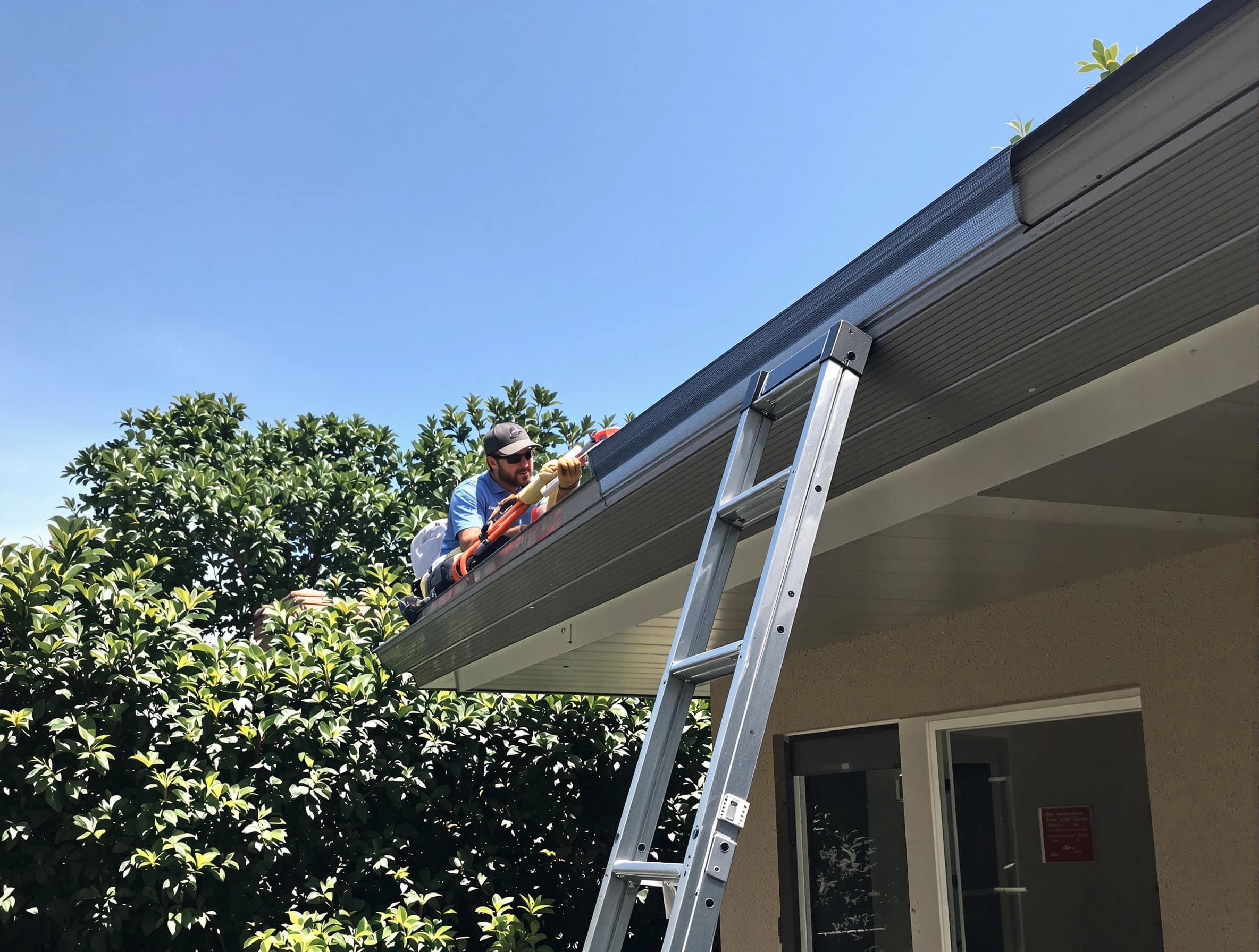 Green Roofing Company installing gutter guards for a homeowner in Green, OH